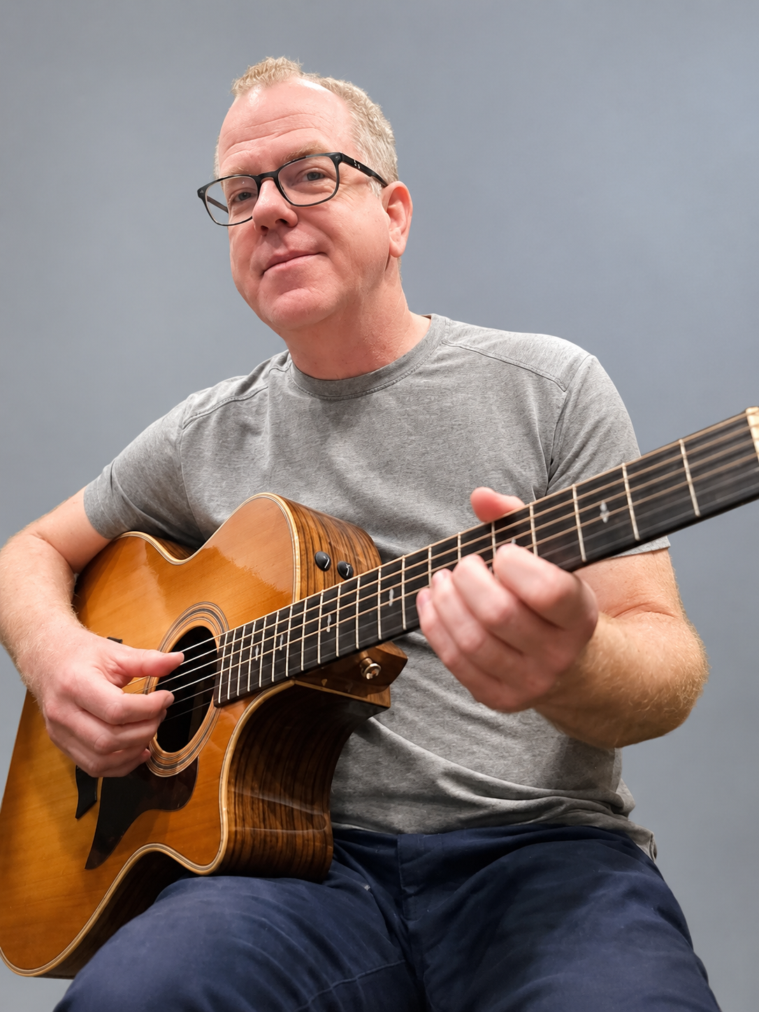 Corey Willis holding a guitar